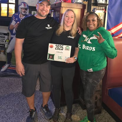 A local business team celebrates DJ's Day of Giving