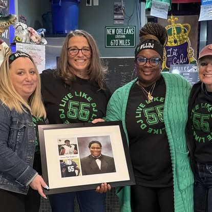Supporters gather in Live Like DJ shirts during the Day of Giving